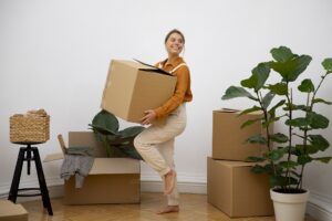 Moving During the Holiday Season - Happy Woman Moving